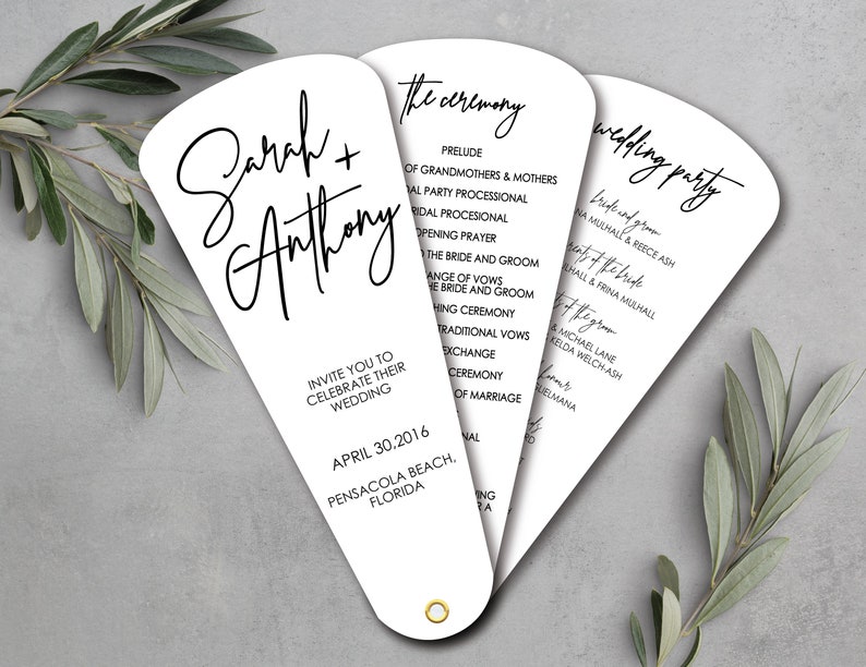 May include: White wedding ceremony program fan with black text. The front of the fan has the couple's names, "Sarah + Anthony", and the date and location of the wedding. The back of the fan lists the order of the ceremony and the wedding party.