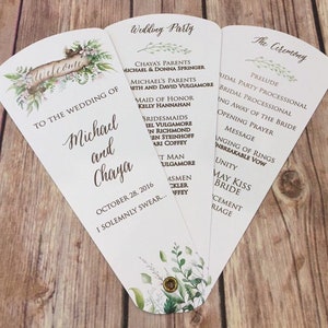 May include: A white wedding program fan with green floral illustrations. The text reads "Wedding Party" and lists the names of the wedding party members. The other side of the fan reads "The Ceremony" and lists the order of events for the ceremony. The date of the wedding is October 28, 2016.