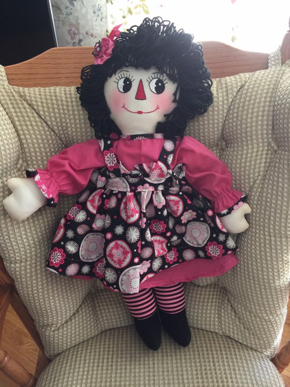 black raggedy ann doll with red hair
