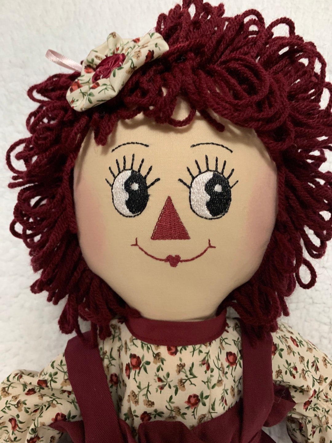 Raggedy Ann Doll in Burgundy and Cream With Two Mauve Lilies