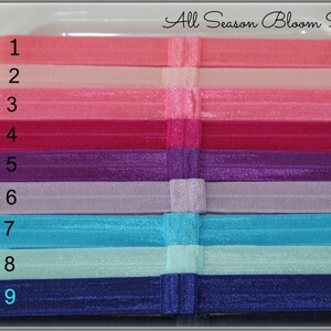 Pu&ograve; includere: Nove elastici per capelli colorati in una variet&agrave; di colori, tra cui rosa, viola, blu e verde. Gli elastici per capelli sono numerati da 1 a 9.