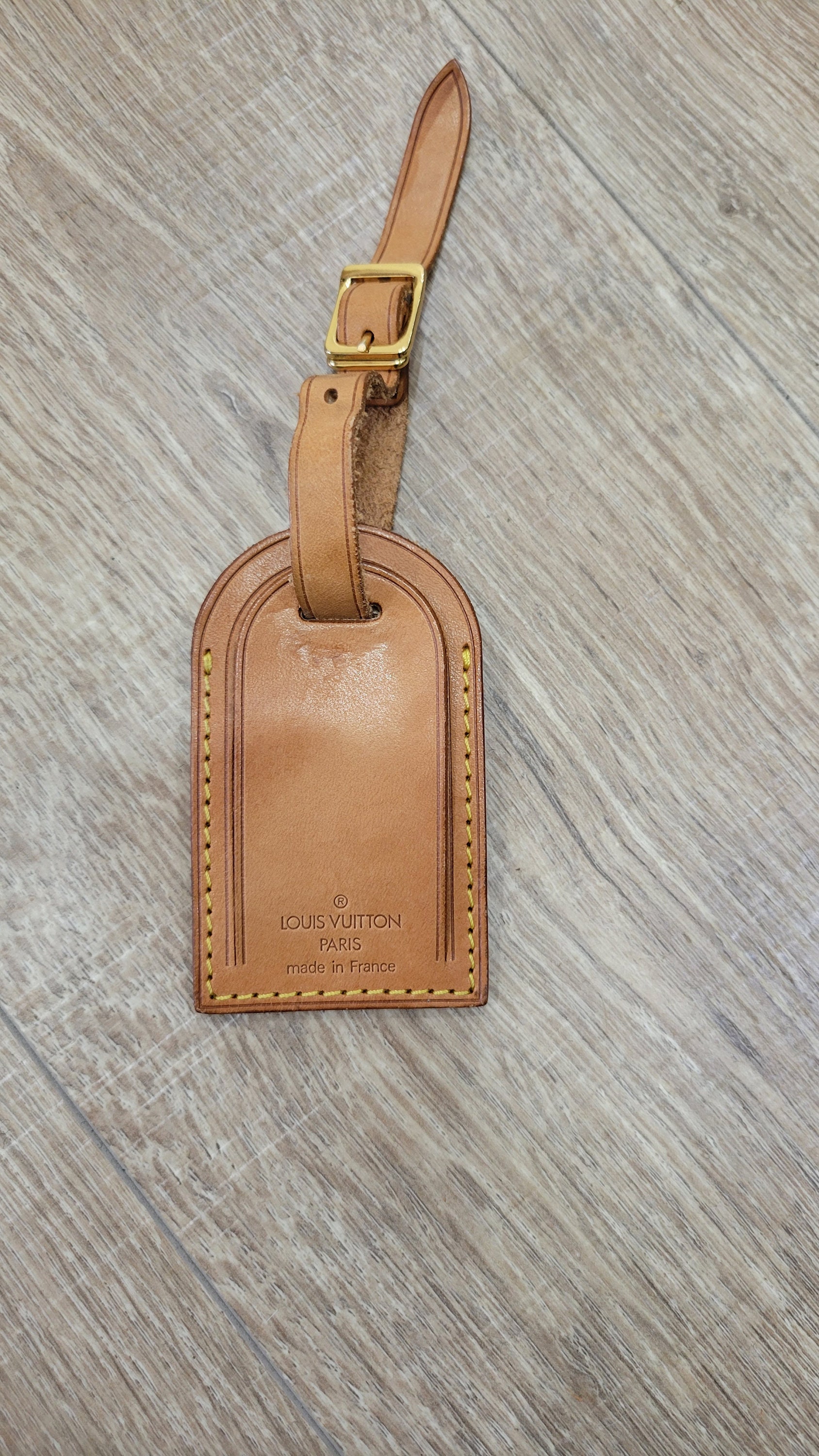 Louis Vuitton luggage tag black Golden Leather ref.359737 - Joli Closet