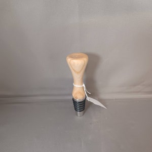 Solid swamp ash bottle stopper with stand up stainless steel tip