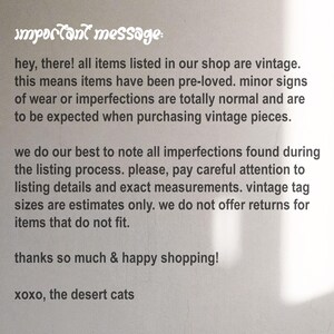 May include: A white informational sign with black text that reads: important message: hey, there! all items listed in our shop are vintage. this means items have been pre-loved. minor signs of wear or imperfections are expected. thanks & happy shopping!
