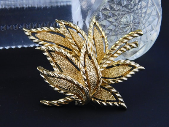 Branded brooch cheap