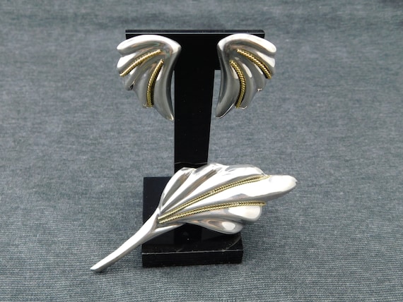 large silver brooches and pins