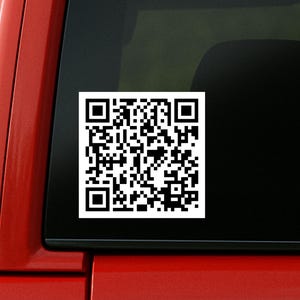 May include: A white square QR code sticker is attached to the rear window of a red vehicle. The sticker features a black and white matrix barcode. The text "Jen's Custom Printing" is visible at the bottom left of the image.