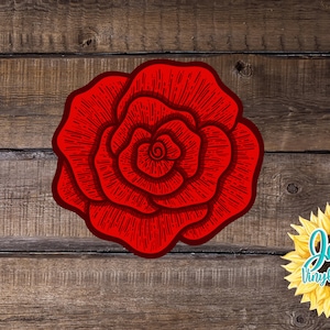 May include: A red rose with a detailed line drawing design on a wood background. The rose is centered in the image. The text "Jen's Vinyl Decals" is in a yellow sunflower graphic in the lower right corner of the image.
