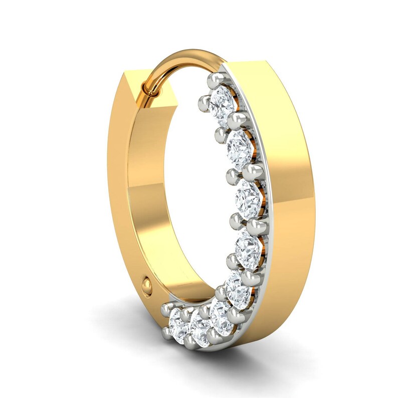 May include: A gold nose ring with a row of small diamonds set in a half circle.