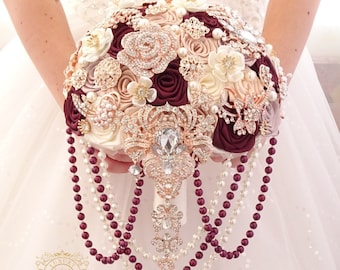 Cascading burgundy rose gold brooch bouquet.