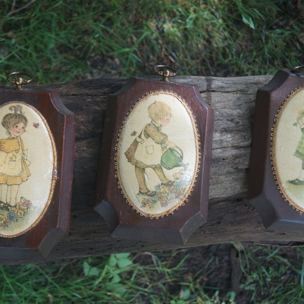 Set of three vintage 1970's Holly Hobby style girls grdening wood mounted wall plaques