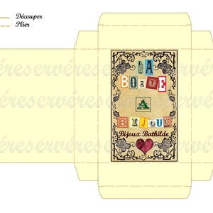 May include: A printable template for a jewelry box. The box is decorated with a vintage-style design featuring the words "La Boite a Bijoux" and a heart. The template includes instructions to cut and fold the paper.