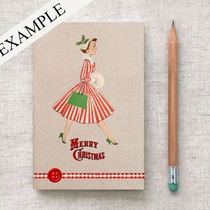 May include: A red and white striped dress with a green bag and a red button. The text "Merry Christmas" is printed below the dress. The background is a brown paper.
