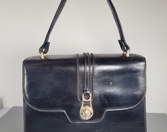 GUCCI Bag. Vintage Gucci black leather top handle bag from 60s.