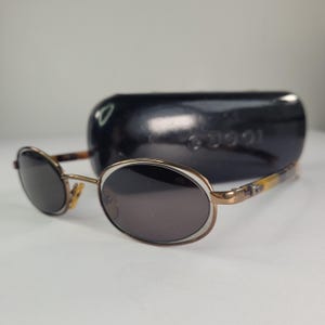 Gucci GG 1614/S Vintage 1990s Oval Sunglasses • Black Gold