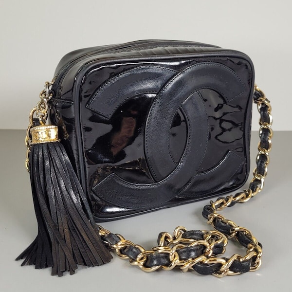 CHANEL Bag. Vintage Chanel black leather camera shoulder bag.