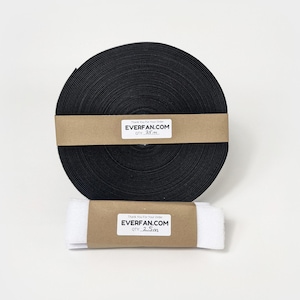 May include: Two rolls of black hook and loop fastener tape. The larger roll is labeled "EVERFAN.COM OTY 25m" and the smaller roll is labeled "EVERFAN.COM OTY 2.5m".