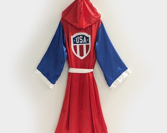 USA Patriotic Satin Boxing Robe with Trim and Shield Embroidered Logo | Custom American Fighter Wrestling Costume Cape with hood and sleeves