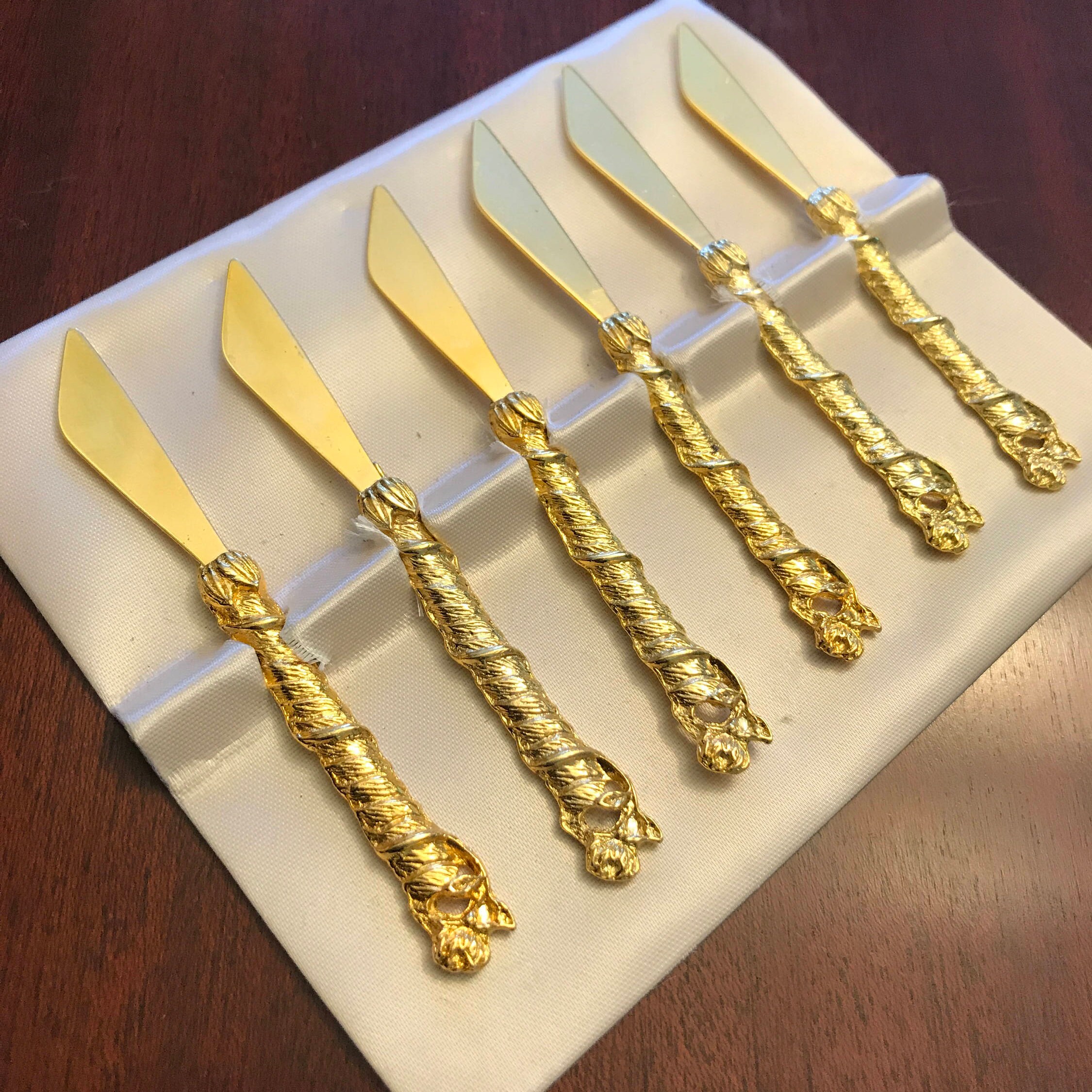 Vintage appetizer knives with ornate gold roses, mini spreaders, gold