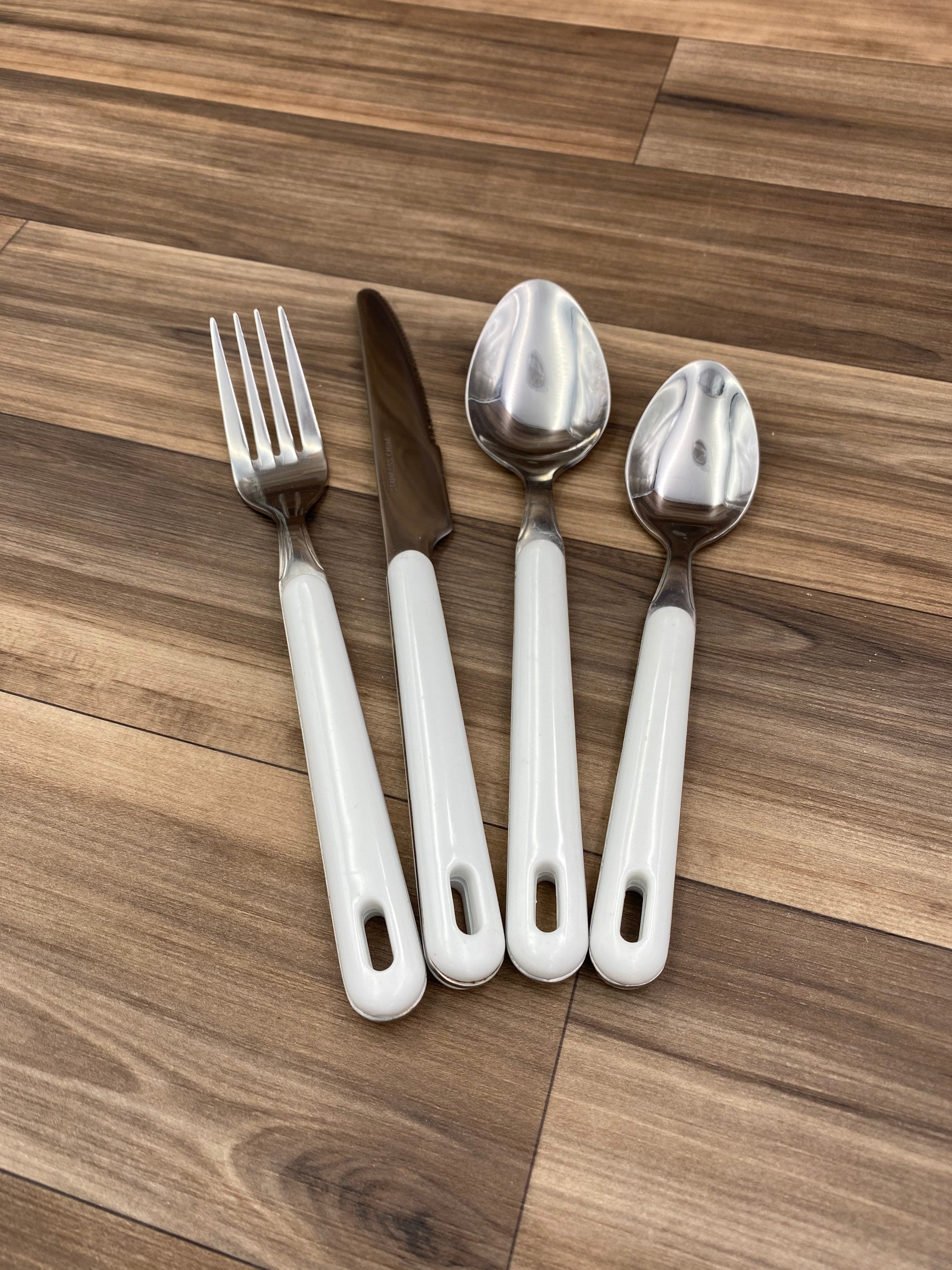 Vintage Flatware set Stainless Steel with White Plastic Handles, pierced handle Flatware set