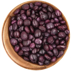 May include: A wooden bowl filled with tumbled ruby gemstones. The stones are a deep, rich purple color and have a smooth, polished finish.