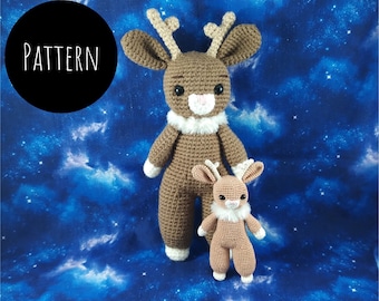 May include: Two crocheted reindeer toys, one larger than the other, standing on a blue and white starry background. The larger reindeer is brown with a white face and white fur around its neck. The smaller reindeer is also brown with a white face and white fur around its neck.