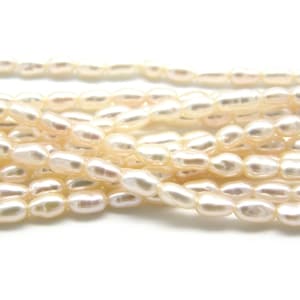 Perlas de agua dulce ovaladas pequeñas en forma de arroz de 2,5 x 4 mm - Blanco crema - Tira, 10 piezas