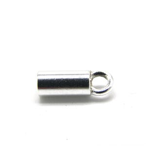 May include: Silver-toned metal end cap with a small loop. The end cap is cylindrical and has a smooth finish.