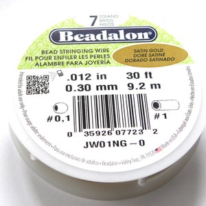 May include: A spool of 7-strand satin gold beading wire, 30 feet long, with a 0.012 inch diameter. The spool is labeled "Beadalon" and has a barcode and a QR code.