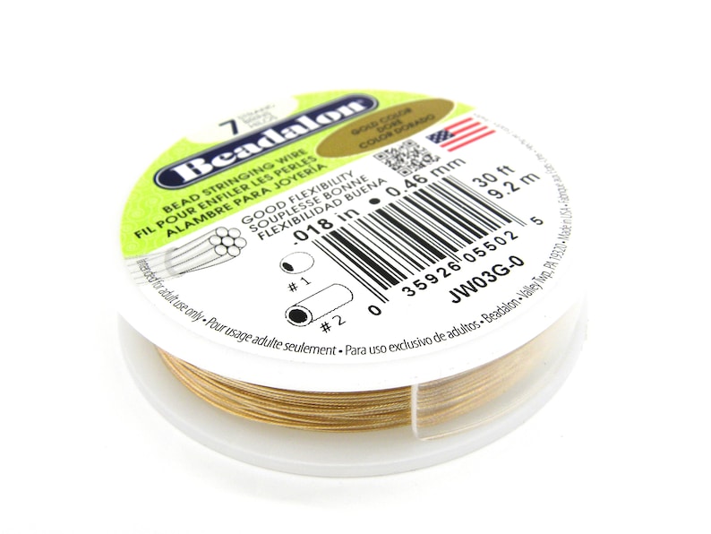 May include: Gold colored Beadalon bead stringing wire, 0.018 inches in diameter, 30 feet long. The spool is labeled with the brand name, size, and material.  The label also includes the text "Good Flexibility" and "Adult Use Only".