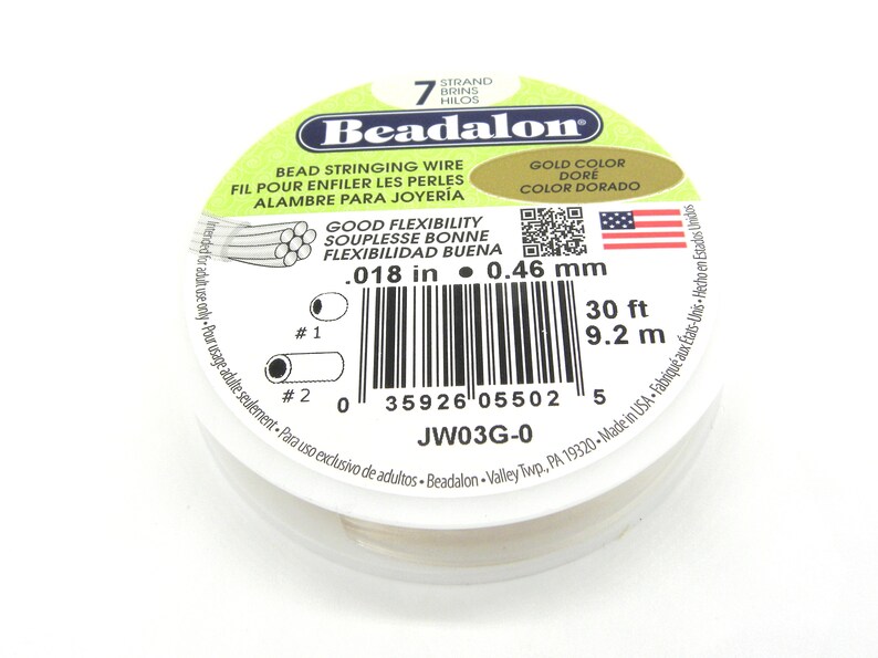 May include: A spool of 7-strand Beadalon bead stringing wire in gold color. The wire is 30 feet long and 0.018 inches in diameter. The label also states that the wire has good flexibility and is made in the USA.