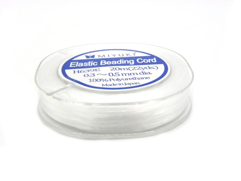 May include: A spool of white elastic beading cord, labeled "MIYUKI Elastic Beading Cord H639E 20m(22yds) 0.3~0.5 mm dia. 100% Polyurethane Made in Japan"
