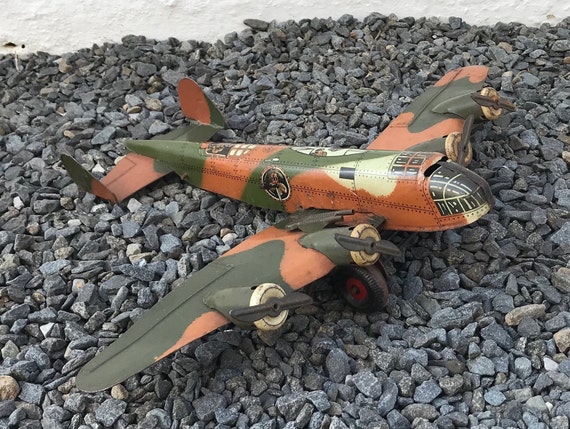 Vintage tin sales toy airplanes