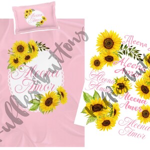 May include: Pink baby blanket with a white circle with the text "Aleena Amor" in cursive. The blanket is decorated with a wreath of sunflowers and green leaves.