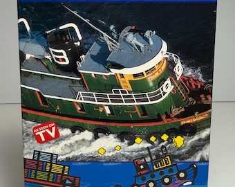 Cassetta vintage del 1993-1994 "All About Hardworking Tugboat" con scatola di carta originale.