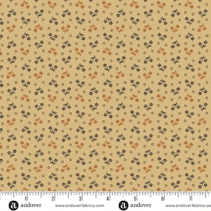 May include: Tan fabric with a repeating pattern of small, stylized flowers in navy blue and rust-orange. The flowers are arranged in a grid-like pattern, with small dots between them. The fabric has a vintage or country aesthetic.