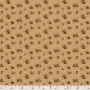 May include: A tan fabric featuring a repeating pattern of small brown and orange floral sprigs and tiny dark brown dots. A white measuring tape with black markings is visible at the bottom, showing a length of eight inches across the fabric.