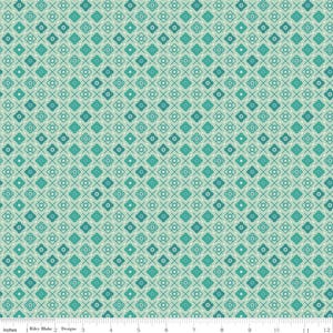May include: A light mint green fabric featuring a repeating pattern of dark teal four-petaled floral shapes, small white dots, and thin dark teal diagonal cross lines. A white ruler at the bottom shows a scale of 12 inches for reference.