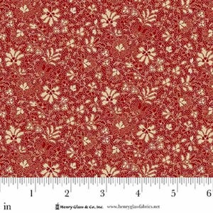 May include: Red fabric with a repeating floral pattern in cream and red. The fabric has a dense, all-over design with small dots and larger floral motifs. The pattern is measured in inches.