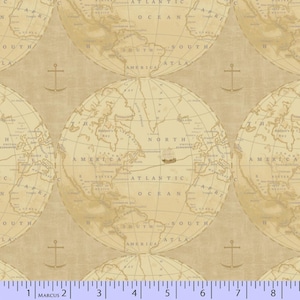 May include: A tan fabric featuring a repeating vintage map pattern of the world with circular globe outlines, nautical anchors, and a small ship illustration. A white ruler measuring 8 inches is visible along the bottom edge of the fabric.