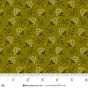 May include: Olive green fabric with a repeating pattern of cream-colored floral clusters, brown sprigs, and small yellow stars. The fabric has a ruler along the bottom edge, with measurements in inches.