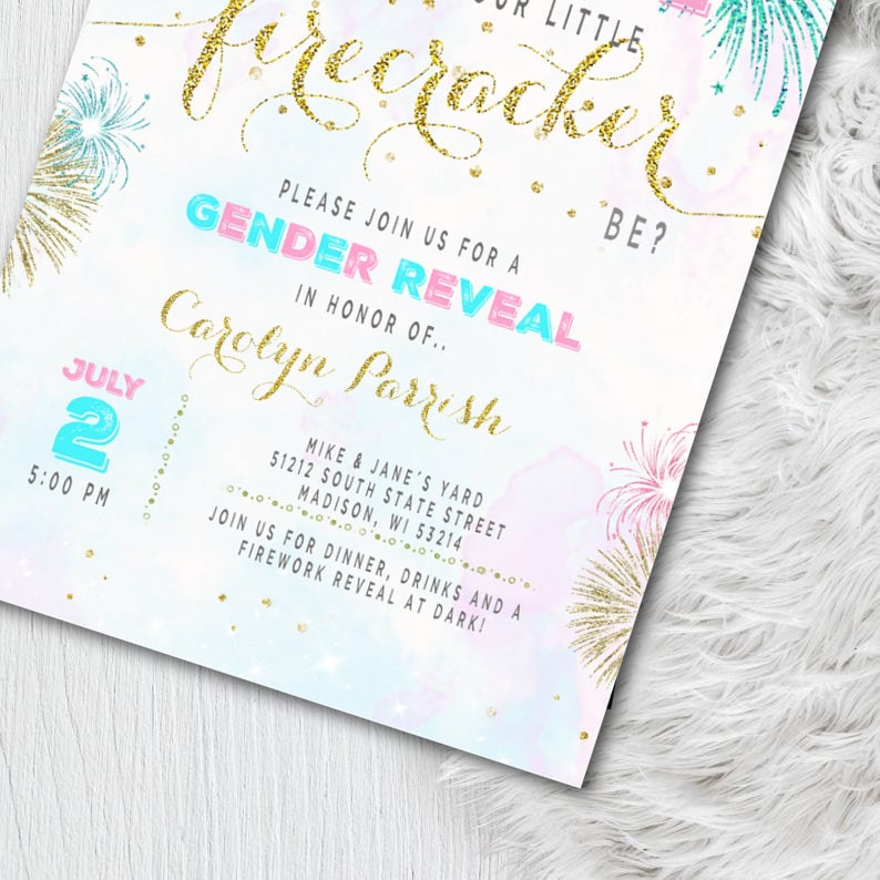 May include: A gender reveal party invitation with a fireworks theme. The invitation features gold glitter text that reads "Our Little Firecracker" and "Gender Reveal." The date and time are displayed in blue and pink. The invitation includes the name Carolyn Parrish.