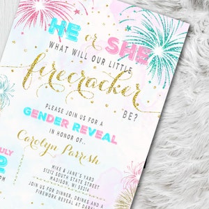 May include: A gender reveal invitation with a fireworks theme. The invitation features the text "He or She? What will our little firecracker be?" in gold glitter script. Pink and teal fireworks and accents are also included.