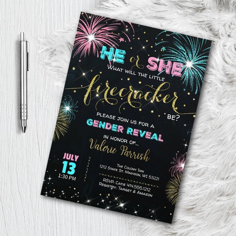 May include: A black gender reveal invitation with pink, blue, and gold accents. The invitation features fireworks, the text "He or She, What will the little firecracker be?" and event details. A silver pen rests on the left.