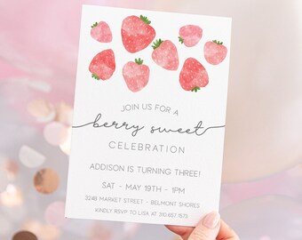 May include: A white invitation card with pink watercolor strawberries and the text "Join us for a berry sweet celebration". The invitation is for a birthday party for Addison who is turning three. The party is on Saturday, May 19th at 1 pm. The address is 3248 Market Street, Belmont Shores. RSVP to Lisa at 310 657.1573.