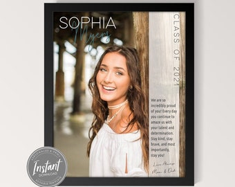May include: A framed graduation photo of Sophia Myers, Class of 2021. The photo is set against a wooden background with a message of congratulations and well wishes from her parents.