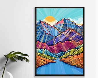 May include: A framed art print featuring a colorful mountain landscape with a bright yellow sun and blue sky. The mountains are depicted in shades of blue, purple, orange, and green. The artwork is signed "Corso Graphics, Artwork by Annie Brace."