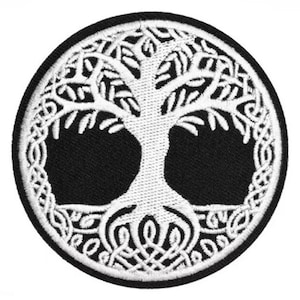 May include: A circular, black and white embroidered patch with a Tree of Life design. The white tree is detailed with branches, trunk, and roots, set against a black backdrop, and framed by a white border.