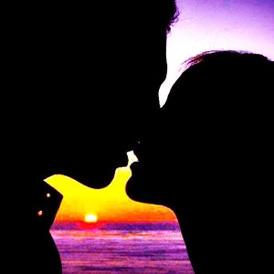 May include: Silhouette of a couple kissing in front of a sunset over the ocean.