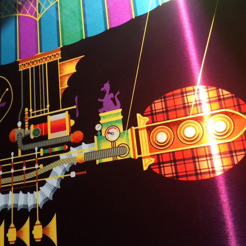 May include: A colorful, whimsical illustration of a fantastical airship or train against a black background. The design features a purple dragon, a plaid pattern, and various mechanical elements in shades of yellow, green, and orange.